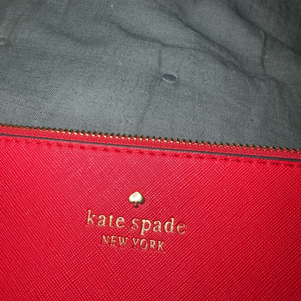 Kate Spade New York Pebbled Leather Wristlet in Red w/ Zipper Closure